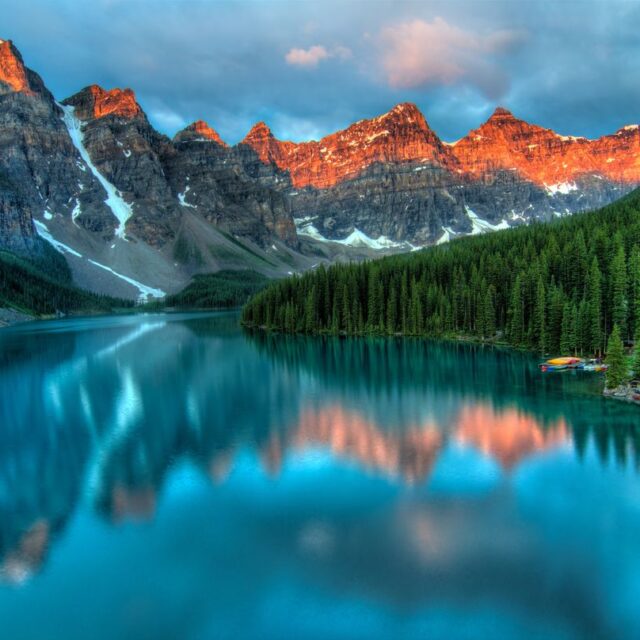 Scenic lake and mountain landscape representing the Claude vs Gemini choice for your personal AI agent
