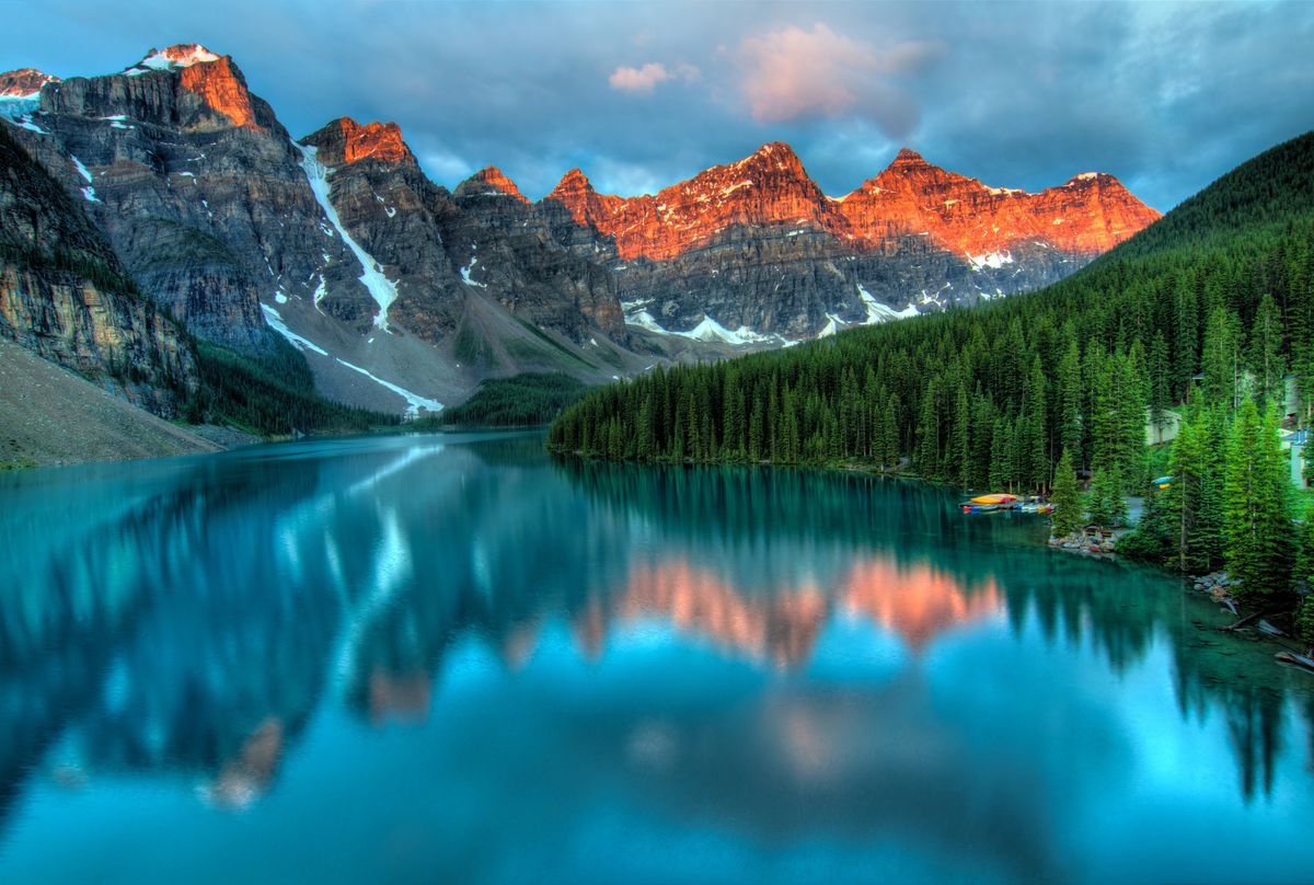 Scenic lake and mountain landscape representing the Claude vs Gemini choice for your personal AI agent